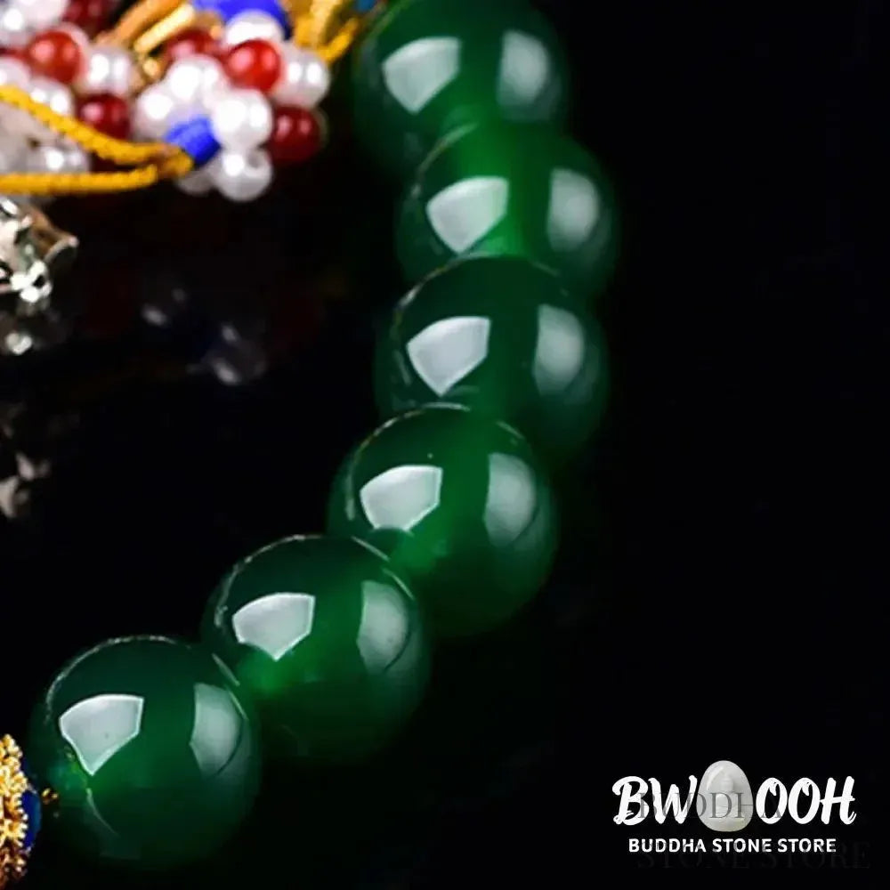 Close-up of BWOOOH Natural Green Agate Wrist Mala, showcasing polished green 10mm, 12mm, 14mm beads on premium elastic string. Designed as a success charm, pocket mala, and car decoration for courage and manifestation during mindfulness practices. - View 9