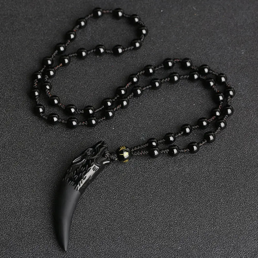 BWOOOH Natural Ice Obsidian Wolf Tooth Pattern Courage Necklace Pendant, available in unisex large (63*14mm) and small (41*14mm) sizes. A striking natural stone pendant for energy protection and strength. - View 2