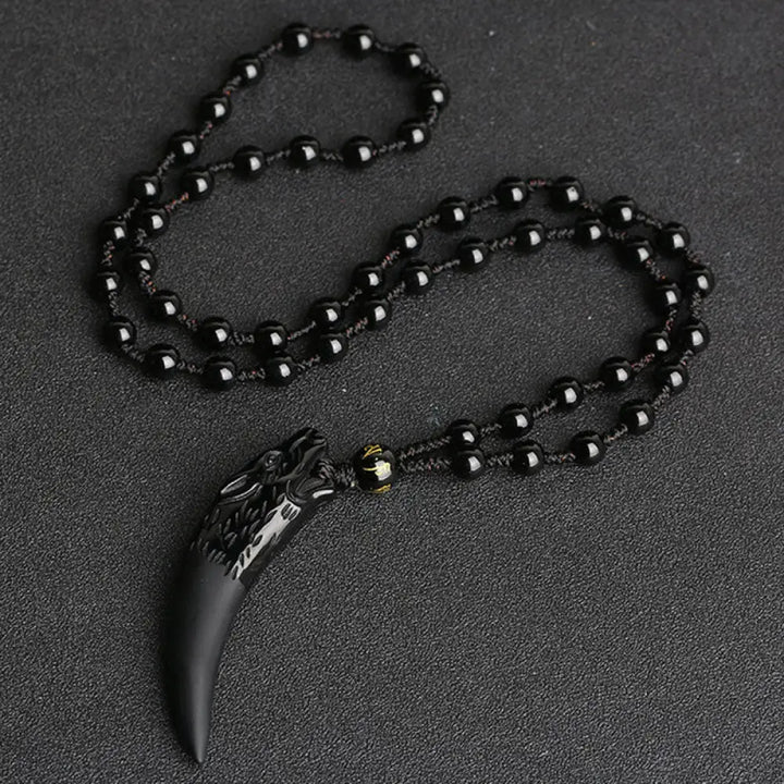 BWOOOH Natural Ice Obsidian Wolf Tooth Pattern Courage Necklace Pendant, available in unisex large (63*14mm) and small (41*14mm) sizes. A striking natural stone pendant for energy protection and strength. - View 2