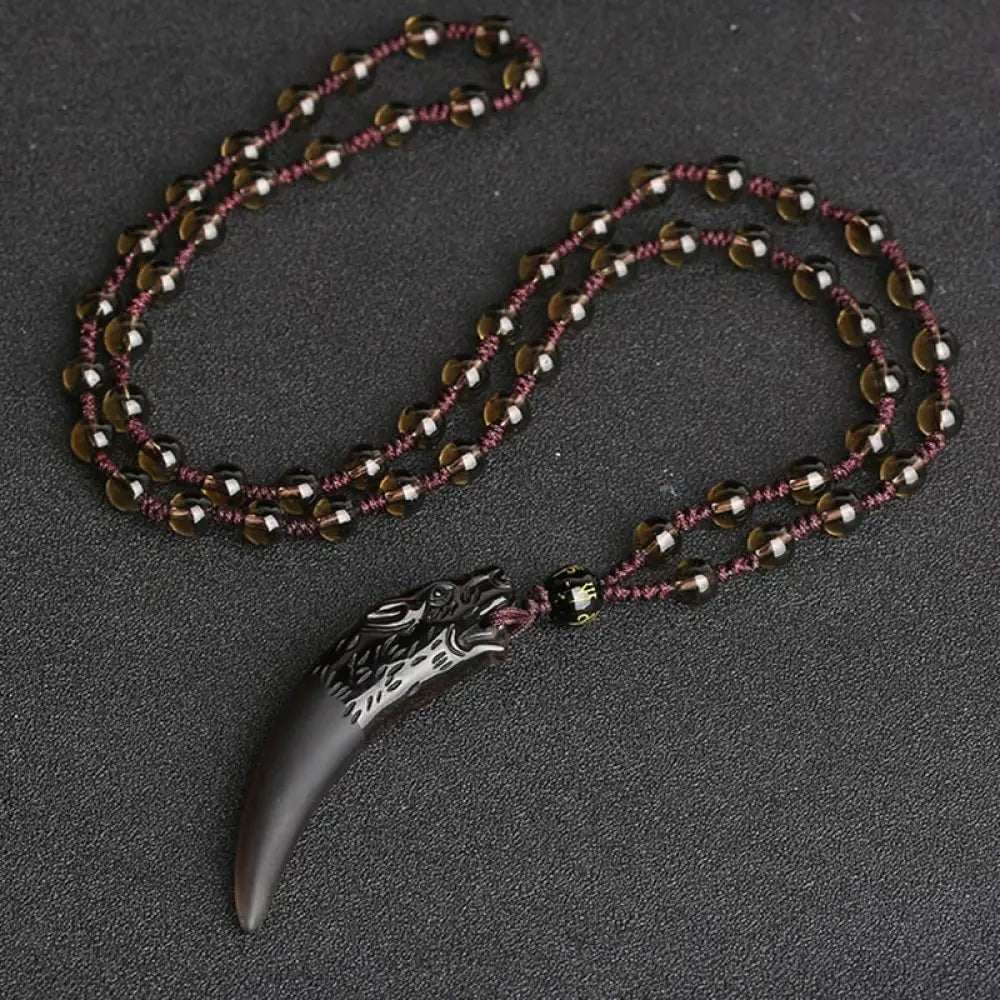 BWOOOH Natural Ice Obsidian Wolf Tooth Pattern Courage Necklace Pendant, available in unisex large (63*14mm) and small (41*14mm) sizes. A striking natural stone pendant for energy protection and strength. - View 8