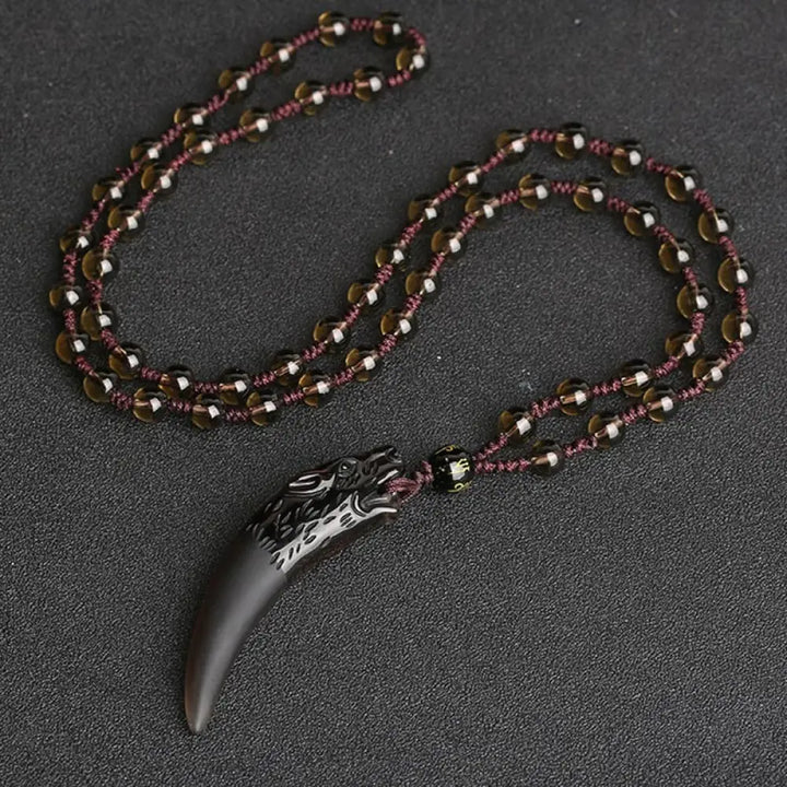 BWOOOH Natural Ice Obsidian Wolf Tooth Pattern Courage Necklace Pendant, available in unisex large (63*14mm) and small (41*14mm) sizes. A striking natural stone pendant for energy protection and strength. - View 8