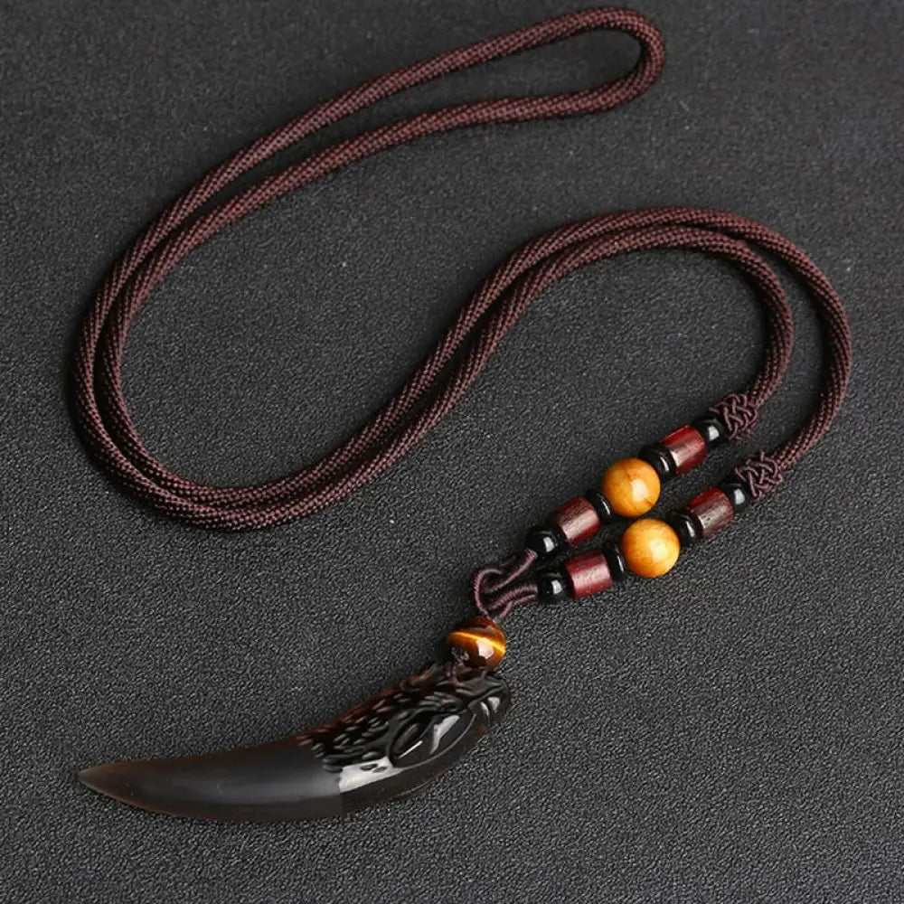 BWOOOH Natural Ice Obsidian Wolf Tooth Pattern Courage Necklace Pendant, available in unisex large (63*14mm) and small (41*14mm) sizes. A striking natural stone pendant for energy protection and strength. - View 4