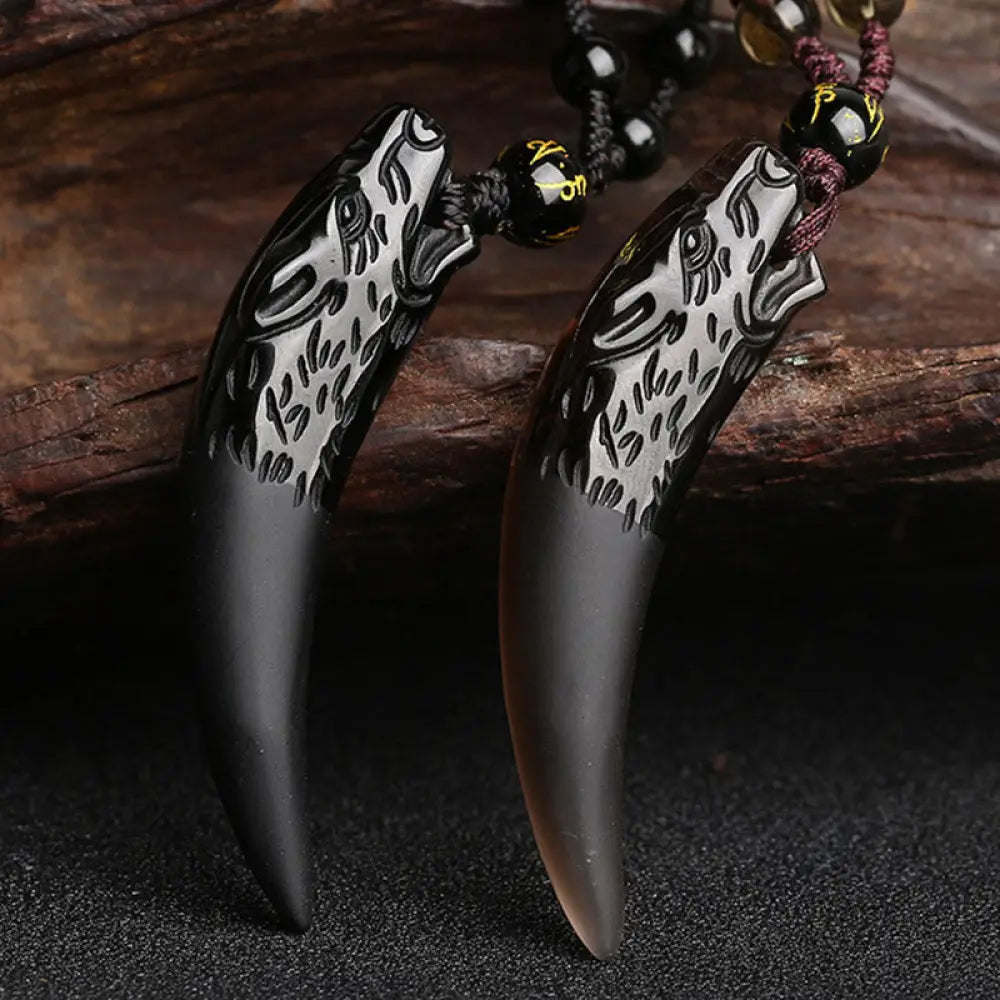 BWOOOH Natural Ice Obsidian Wolf Tooth Pattern Courage Necklace Pendant, available in unisex large (63*14mm) and small (41*14mm) sizes. A striking natural stone pendant for energy protection and strength.