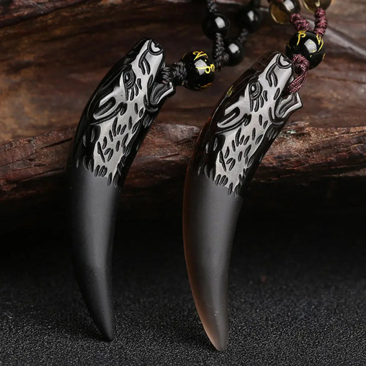 BWOOOH Natural Ice Obsidian Wolf Tooth Pattern Courage Necklace Pendant, available in unisex large (63*14mm) and small (41*14mm) sizes. A striking natural stone pendant for energy protection and strength.