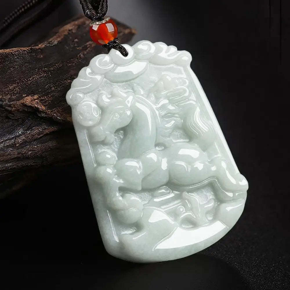 A BWOOOH Natural Jade 12 Chinese Zodiac Abundance Amulet Pendant Necklace, featuring intricate carvings of animals like the Dragon and Tiger, symbolizing prosperity and spiritual balance. The jade stone is polished, reflecting light and emphasizing its natural beauty. - View 7