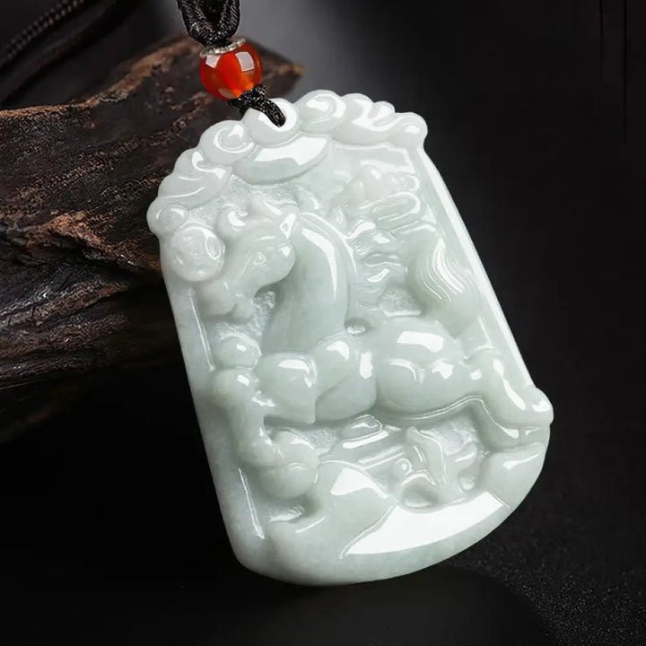 A BWOOOH Natural Jade 12 Chinese Zodiac Abundance Amulet Pendant Necklace, featuring intricate carvings of animals like the Dragon and Tiger, symbolizing prosperity and spiritual balance. The jade stone is polished, reflecting light and emphasizing its natural beauty. - View 7