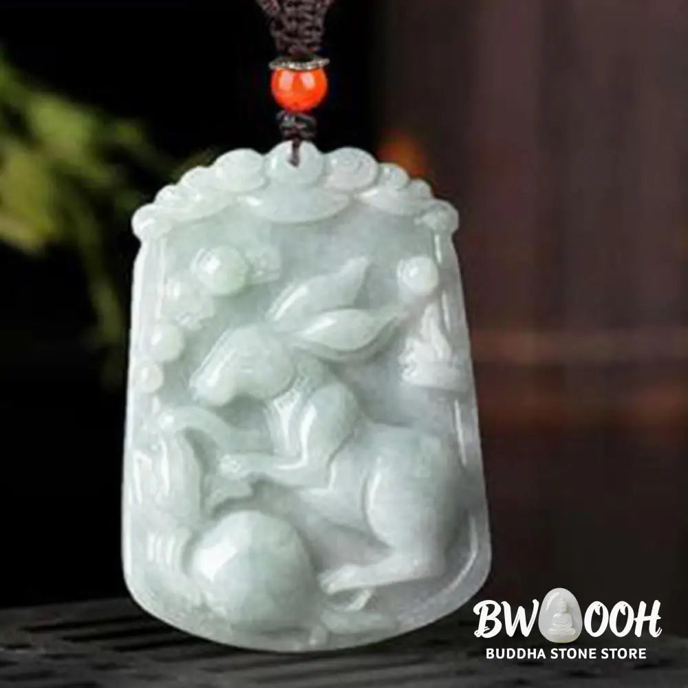 A BWOOOH Natural Jade 12 Chinese Zodiac Abundance Amulet Pendant Necklace, featuring intricate carvings of animals like the Dragon and Tiger, symbolizing prosperity and spiritual balance. The jade stone is polished, reflecting light and emphasizing its natural beauty. - View 17