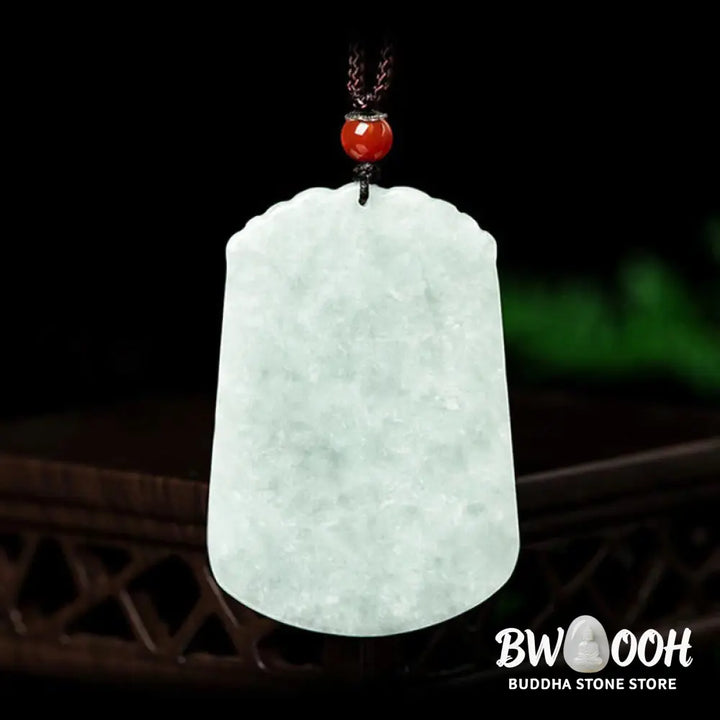 A BWOOOH Natural Jade 12 Chinese Zodiac Abundance Amulet Pendant Necklace, featuring intricate carvings of animals like the Dragon and Tiger, symbolizing prosperity and spiritual balance. The jade stone is polished, reflecting light and emphasizing its natural beauty. - View 2