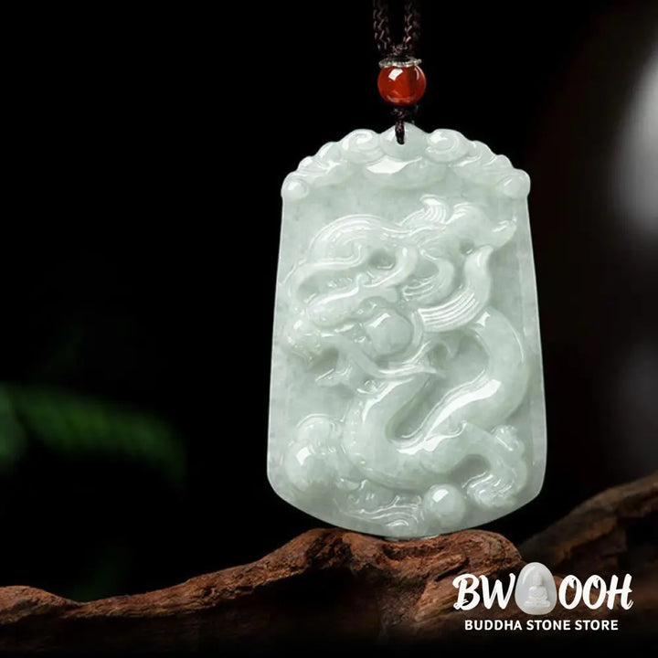 A BWOOOH Natural Jade 12 Chinese Zodiac Abundance Amulet Pendant Necklace, featuring intricate carvings of animals like the Dragon and Tiger, symbolizing prosperity and spiritual balance. The jade stone is polished, reflecting light and emphasizing its natural beauty. - View 18