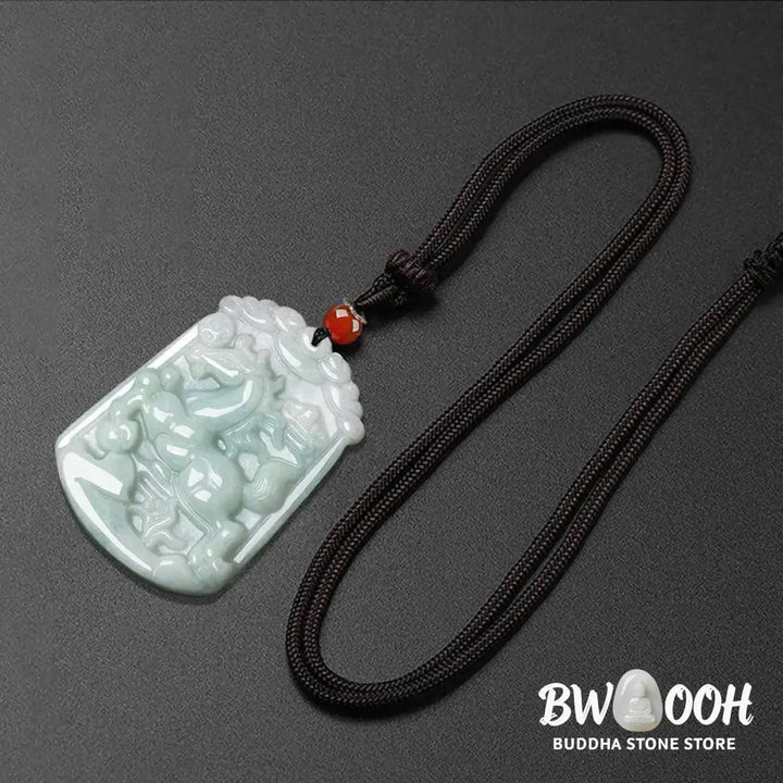 A BWOOOH Natural Jade 12 Chinese Zodiac Abundance Amulet Pendant Necklace, featuring intricate carvings of animals like the Dragon and Tiger, symbolizing prosperity and spiritual balance. The jade stone is polished, reflecting light and emphasizing its natural beauty. - View 20