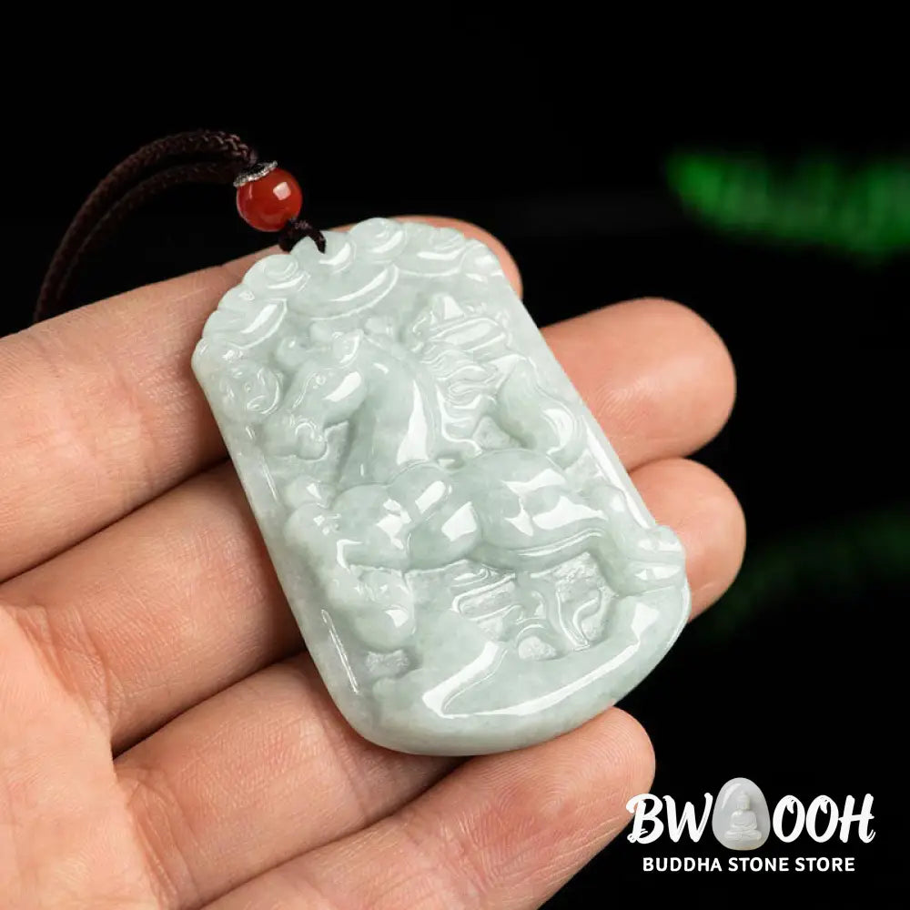 A BWOOOH Natural Jade 12 Chinese Zodiac Abundance Amulet Pendant Necklace, featuring intricate carvings of animals like the Dragon and Tiger, symbolizing prosperity and spiritual balance. The jade stone is polished, reflecting light and emphasizing its natural beauty. - View 9