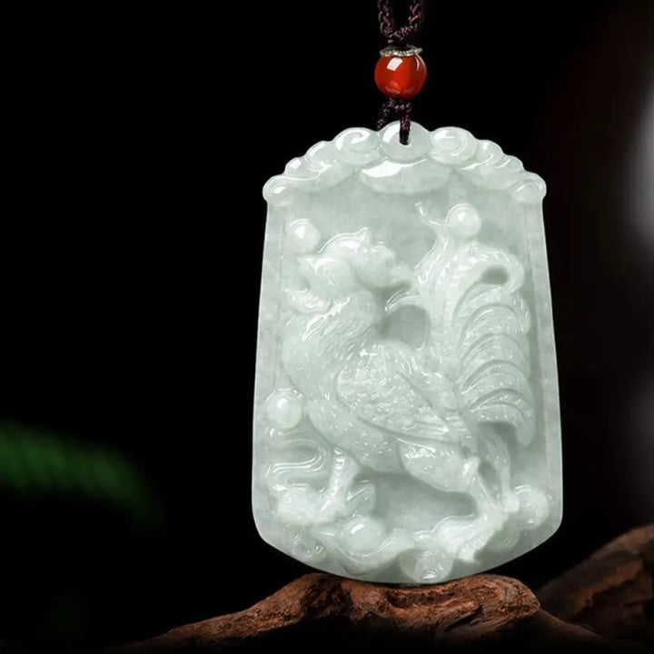 A BWOOOH Natural Jade 12 Chinese Zodiac Abundance Amulet Pendant Necklace, featuring intricate carvings of animals like the Dragon and Tiger, symbolizing prosperity and spiritual balance. The jade stone is polished, reflecting light and emphasizing its natural beauty. - View 23