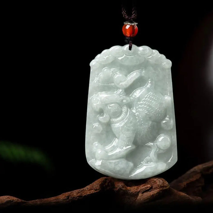 A BWOOOH Natural Jade 12 Chinese Zodiac Abundance Amulet Pendant Necklace, featuring intricate carvings of animals like the Dragon and Tiger, symbolizing prosperity and spiritual balance. The jade stone is polished, reflecting light and emphasizing its natural beauty. - View 15