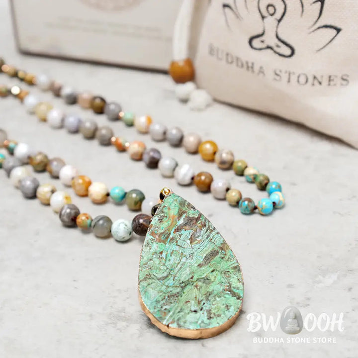 A close-up of the BWOOOH Natural Ocean Picasso Jasper Beaded Healing Necklace, 33.5 inches long, showcasing unique patterns of sea sediment, picture, and Picasso jasper stones. Unisex design. - View 10