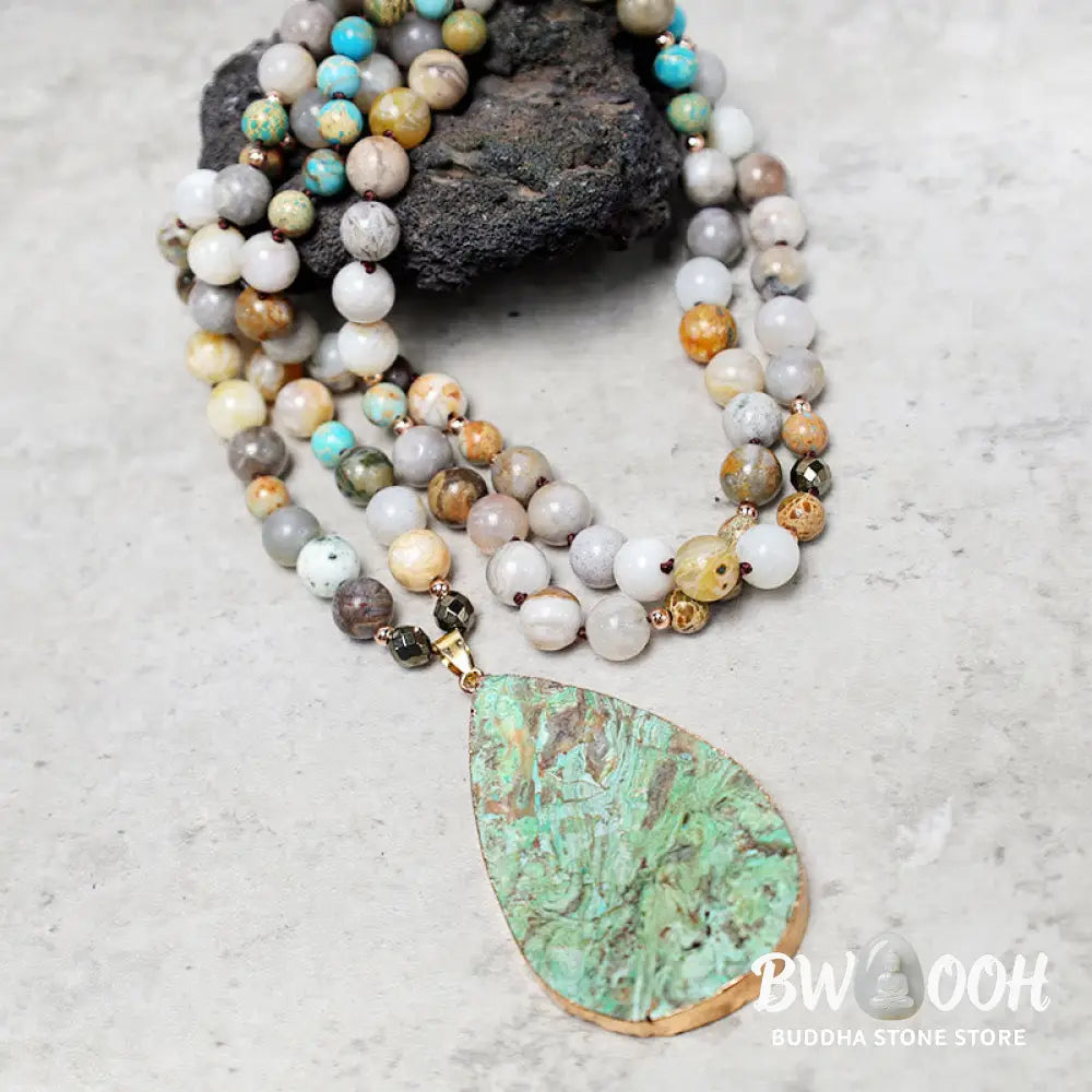 A close-up of the BWOOOH Natural Ocean Picasso Jasper Beaded Healing Necklace, 33.5 inches long, showcasing unique patterns of sea sediment, picture, and Picasso jasper stones. Unisex design. - View 5