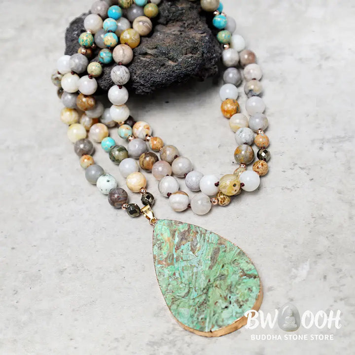 A close-up of the BWOOOH Natural Ocean Picasso Jasper Beaded Healing Necklace, 33.5 inches long, showcasing unique patterns of sea sediment, picture, and Picasso jasper stones. Unisex design. - View 5