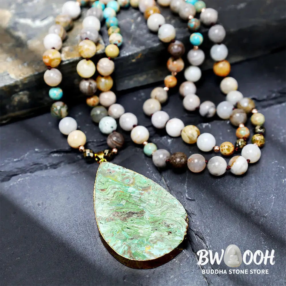 A close-up of the BWOOOH Natural Ocean Picasso Jasper Beaded Healing Necklace, 33.5 inches long, showcasing unique patterns of sea sediment, picture, and Picasso jasper stones. Unisex design. - View 3