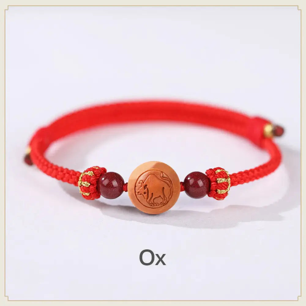 BWOOOH Natural Peach Wood Chinese Zodiac Fu Character Carved Cinnabar Wealth Bracelet - Ox-Red(Wrist