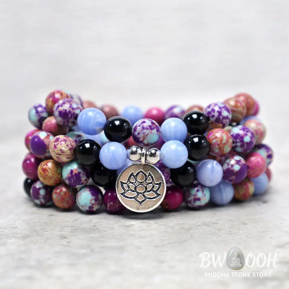 A BWOOOH Natural Purple Miano Real Stone Lotus Mala featuring 108 polished 8mm purple beads, a detailed Lotus symbol charm, and a guru bead, designed for mindful meditation and spiritual balance. The mala is 37 inches long, handcrafted for unisex wear. - View 6