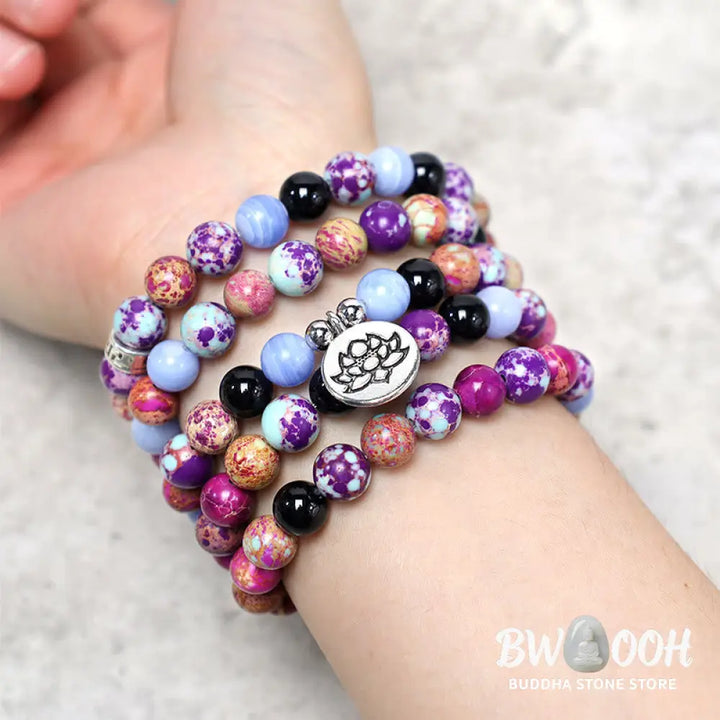 A BWOOOH Natural Purple Miano Real Stone Lotus Mala featuring 108 polished 8mm purple beads, a detailed Lotus symbol charm, and a guru bead, designed for mindful meditation and spiritual balance. The mala is 37 inches long, handcrafted for unisex wear. - View 5