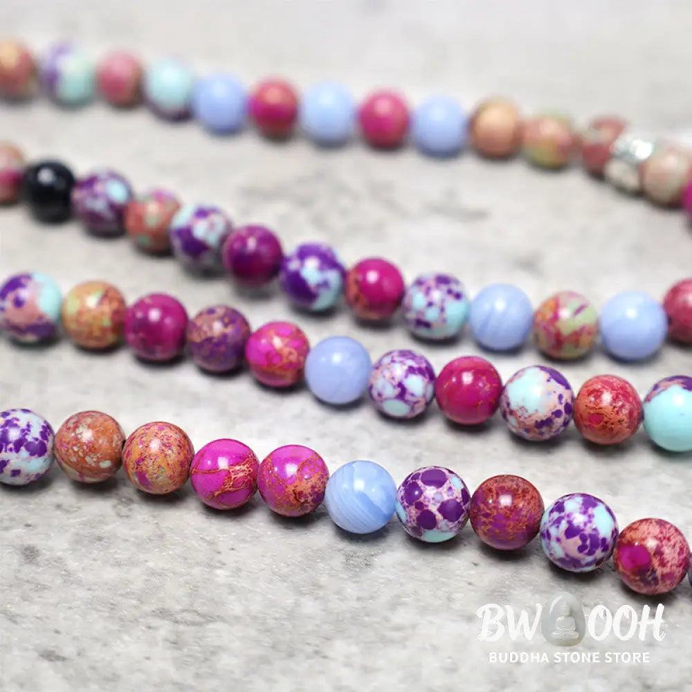 A BWOOOH Natural Purple Miano Real Stone Lotus Mala featuring 108 polished 8mm purple beads, a detailed Lotus symbol charm, and a guru bead, designed for mindful meditation and spiritual balance. The mala is 37 inches long, handcrafted for unisex wear. - View 7