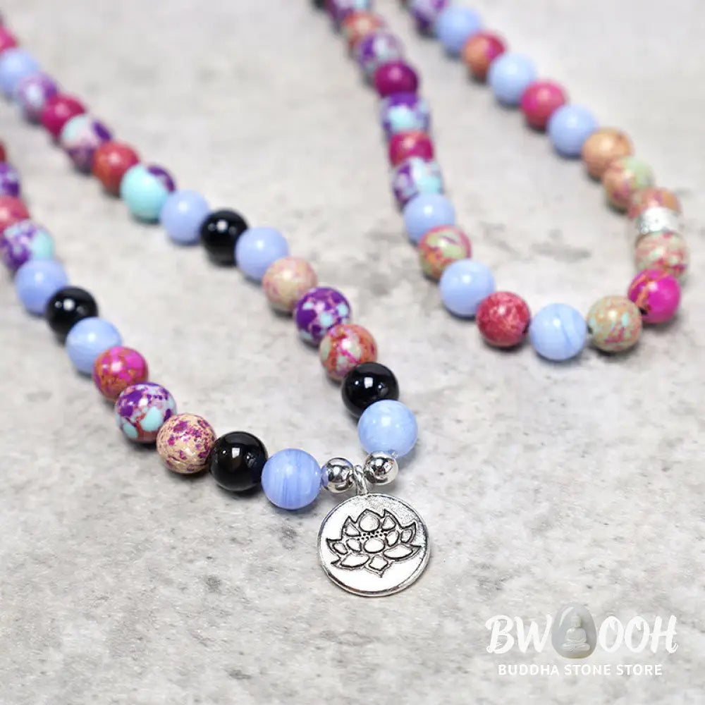 A BWOOOH Natural Purple Miano Real Stone Lotus Mala featuring 108 polished 8mm purple beads, a detailed Lotus symbol charm, and a guru bead, designed for mindful meditation and spiritual balance. The mala is 37 inches long, handcrafted for unisex wear. - View 4