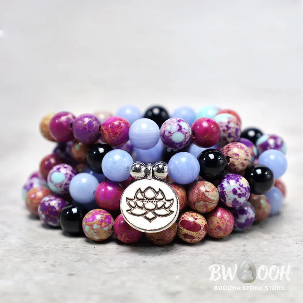 A BWOOOH Natural Purple Miano Real Stone Lotus Mala featuring 108 polished 8mm purple beads, a detailed Lotus symbol charm, and a guru bead, designed for mindful meditation and spiritual balance. The mala is 37 inches long, handcrafted for unisex wear. - View 2
