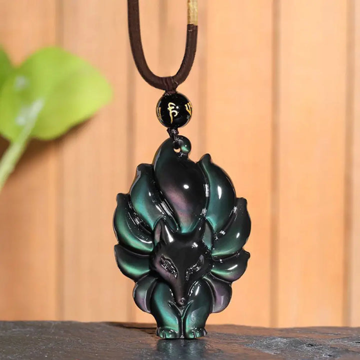 BWOOOH Rainbow &amp; Gold Sheen Obsidian Nine-Tailed Fox pendant. Iridescent colors, handcrafted natural gemstone symbolizing wisdom, protection from negativity, and attracting love for positive transformation.