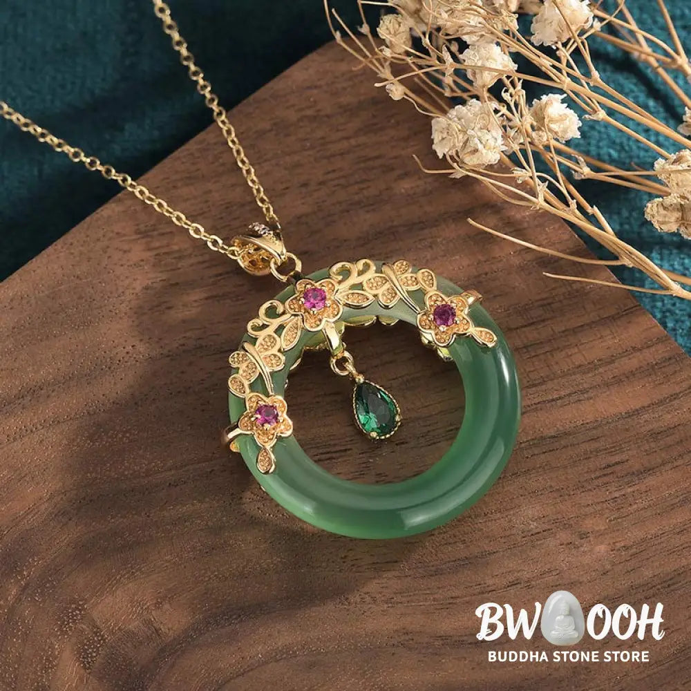 A BWOOOH Natural Round Cyan Jade Healing Necklace Pendant, 30x40mm, suspended on a 40-50cm chain, showcasing its serene blue-green hue, symbolic of success, harmony, and luck for spiritual wellness and mental clarity. - View 2