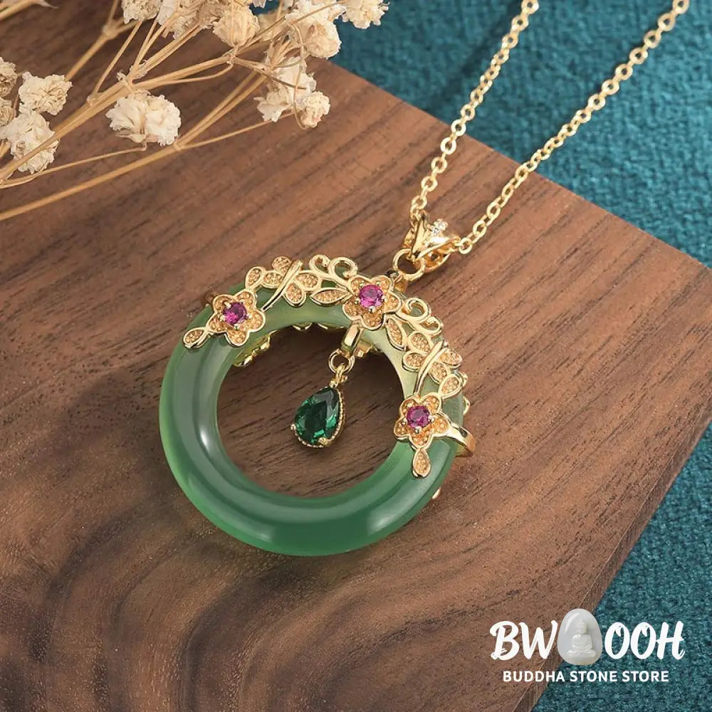 A BWOOOH Natural Round Cyan Jade Healing Necklace Pendant, 30x40mm, suspended on a 40-50cm chain, showcasing its serene blue-green hue, symbolic of success, harmony, and luck for spiritual wellness and mental clarity. - View 3