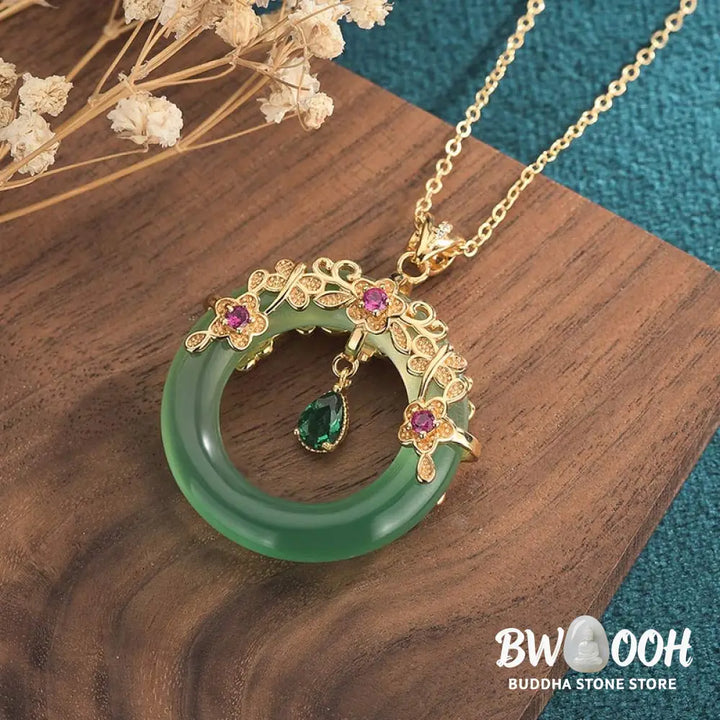 A BWOOOH Natural Round Cyan Jade Healing Necklace Pendant, 30x40mm, suspended on a 40-50cm chain, showcasing its serene blue-green hue, symbolic of success, harmony, and luck for spiritual wellness and mental clarity. - View 3