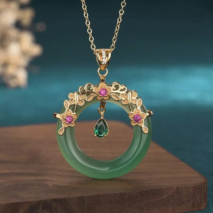 A BWOOOH Natural Round Cyan Jade Healing Necklace Pendant, 30x40mm, suspended on a 40-50cm chain, showcasing its serene blue-green hue, symbolic of success, harmony, and luck for spiritual wellness and mental clarity.