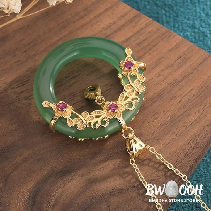 A BWOOOH Natural Round Cyan Jade Healing Necklace Pendant, 30x40mm, suspended on a 40-50cm chain, showcasing its serene blue-green hue, symbolic of success, harmony, and luck for spiritual wellness and mental clarity. - View 4