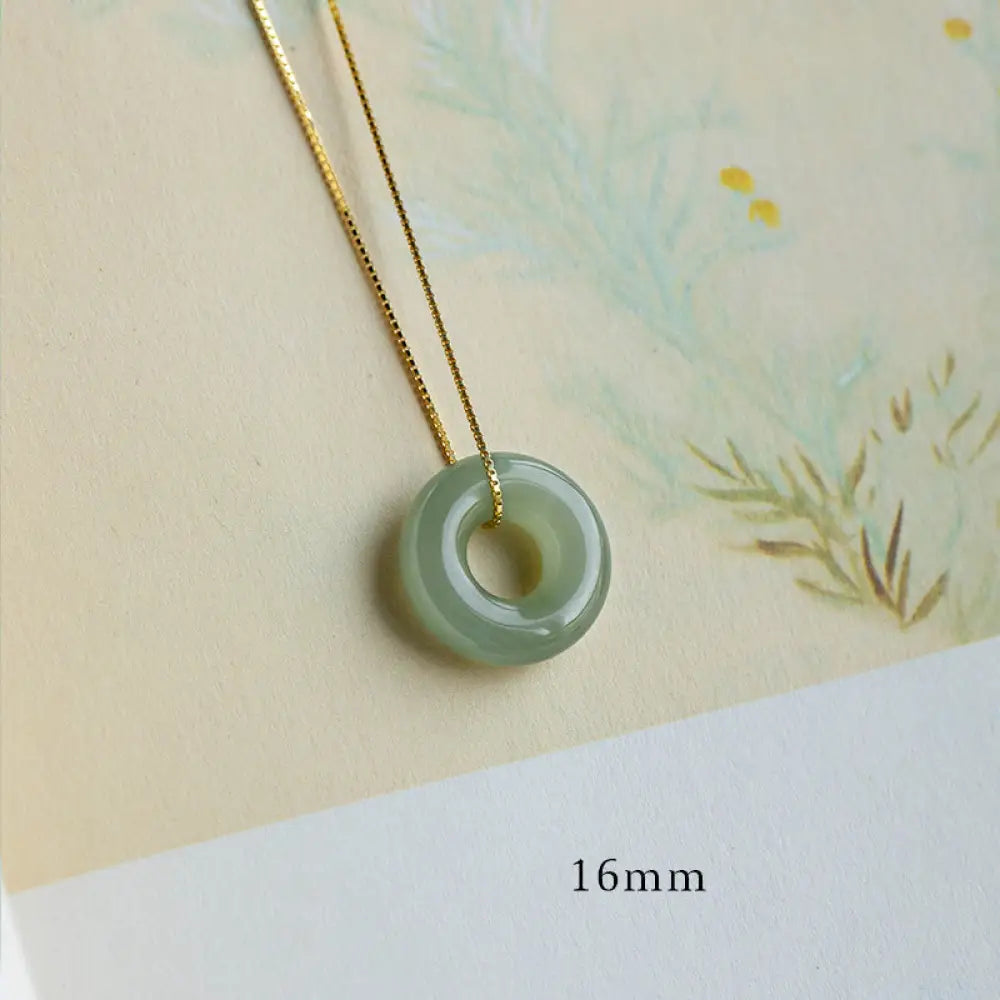 BWOOOH Natural Round Jade Peace Buckle Necklace featuring a polished green Jade disc, 40cm 925 sterling silver plated gold chain, symbolizing luck and abundance. - View 5