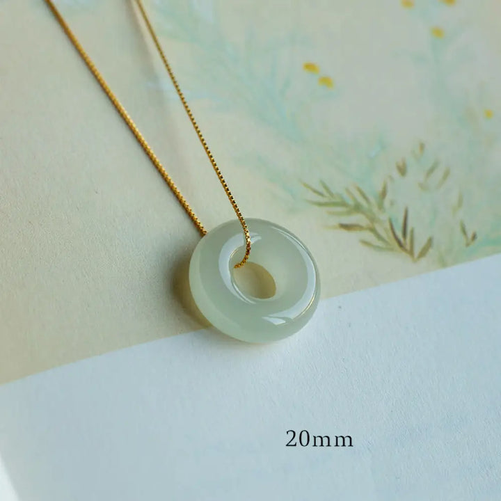 BWOOOH Natural Round Jade Peace Buckle Necklace featuring a polished green Jade disc, 40cm 925 sterling silver plated gold chain, symbolizing luck and abundance. - View 7