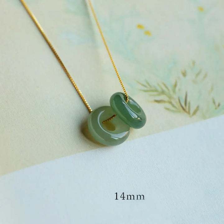 BWOOOH Natural Round Jade Peace Buckle Necklace featuring a polished green Jade disc, 40cm 925 sterling silver plated gold chain, symbolizing luck and abundance. - View 14