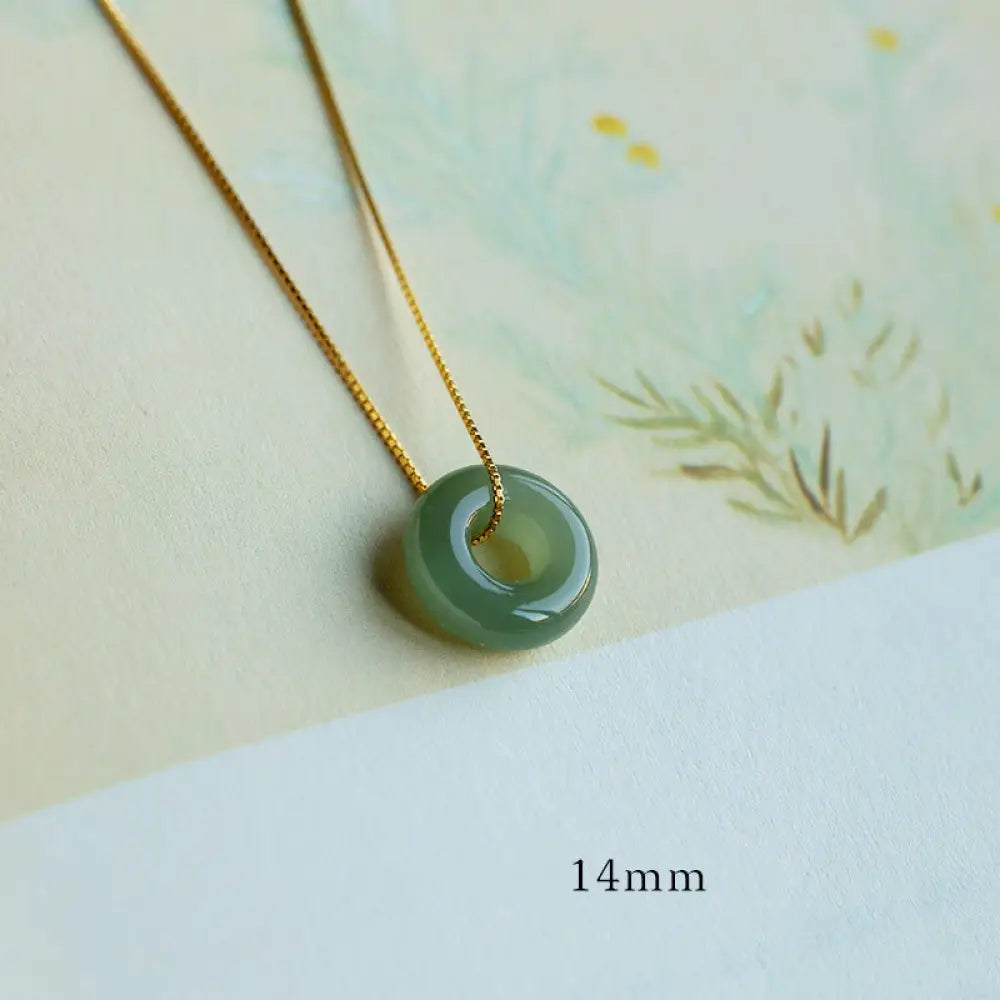 BWOOOH Natural Round Jade Peace Buckle Necklace featuring a polished green Jade disc, 40cm 925 sterling silver plated gold chain, symbolizing luck and abundance. - View 9