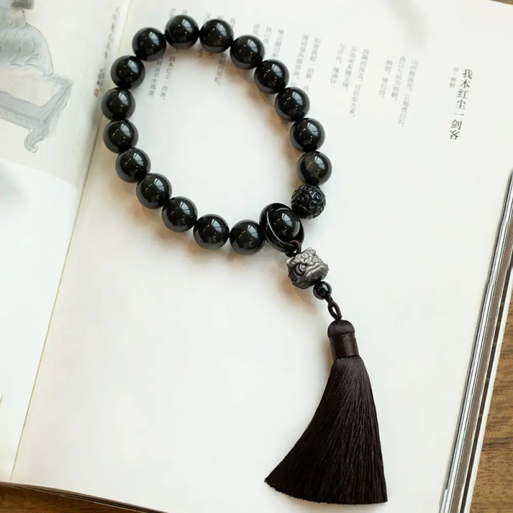 BWOOOH Natural Silver Sheen Obsidian and Black Obsidian Lion Wrist Mala with Tassels. 14mm/16mm beads, 16*15*15mm lion, for protection, courage, and positive Feng Shui energy. - View 13