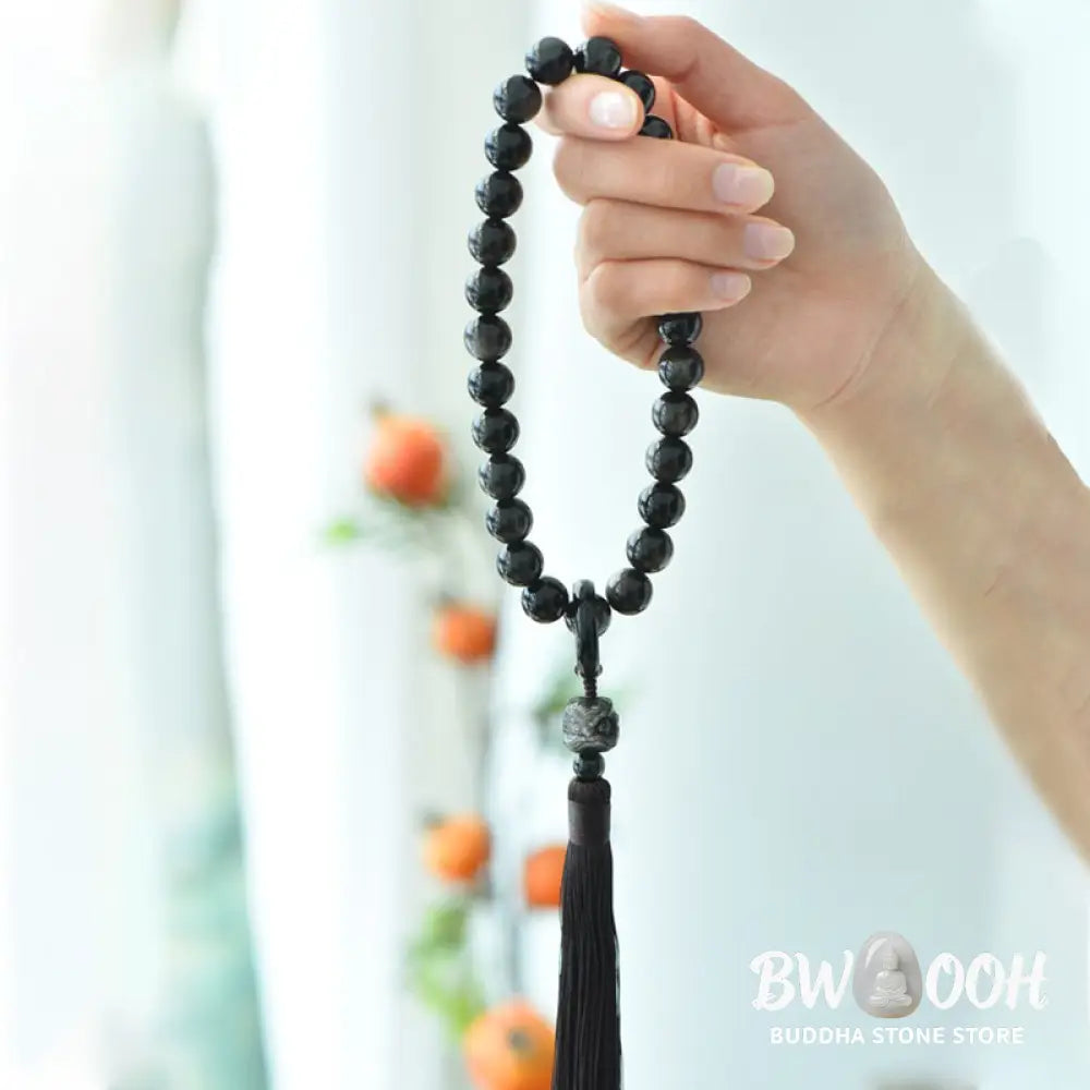 BWOOOH Silver Sheen Obsidian Lion Wrist Mala, polished beads (12-16mm), carved lion, tassels. Offers energetic protection, also a pocket mala or car decoration. - View 4