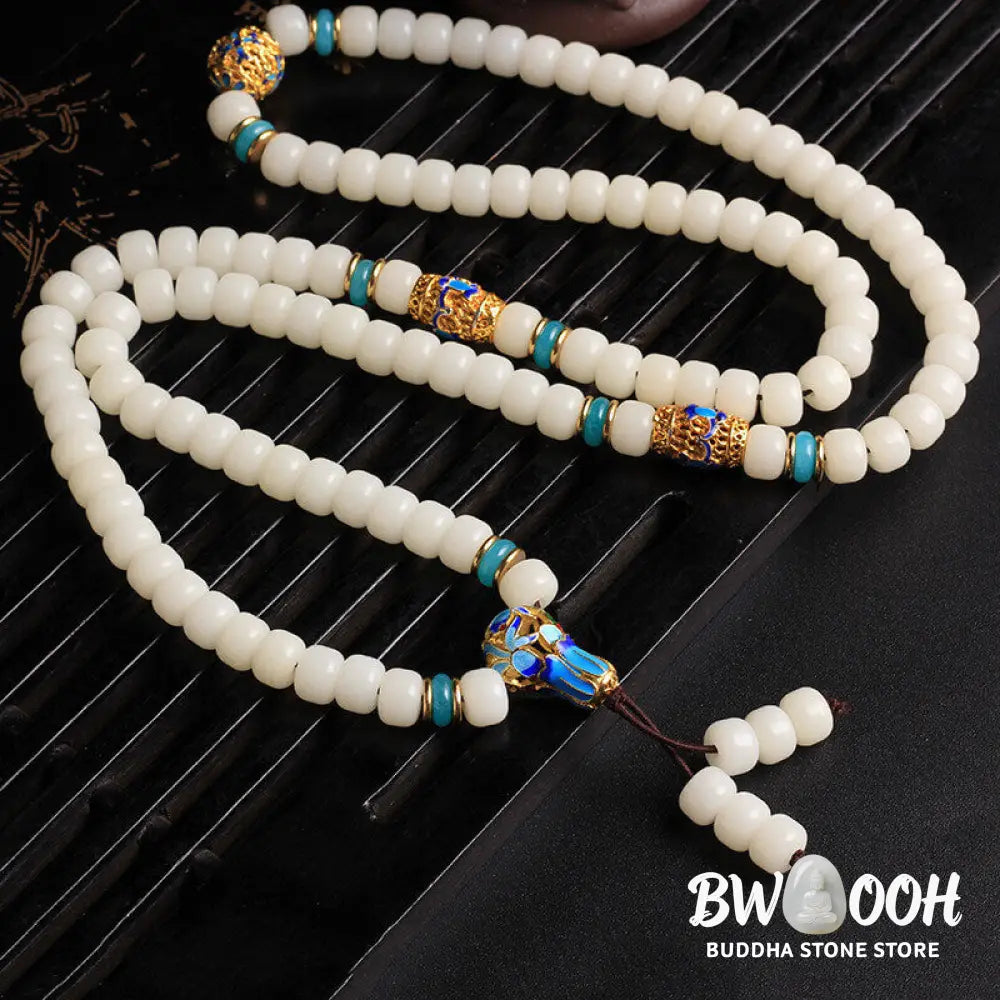 A BWOOOH Natural White Bodhi Seed Mala bracelet, featuring 108 dark-speckled beads, handmade for meditation, spiritual wisdom, and attracting wealth. Unisex design, worn on wrist. - View 5