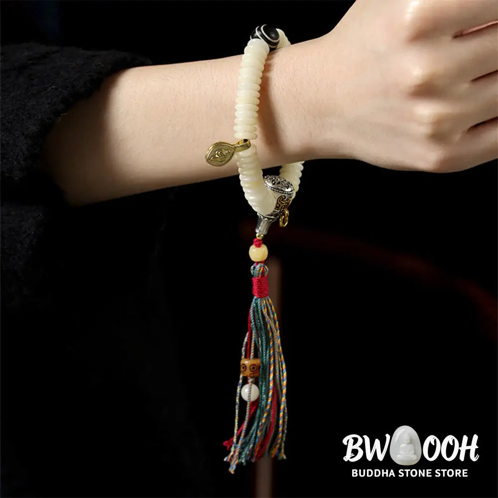 BWOOOH Natural White Bodhi Seed Wisdom Tassel Wrist Mala Bracelet, featuring dark-speckled Bodhi seeds (3x10mm) with a white copper accent and soft tassel, on a 14-15cm elastic string. Ideal for meditation and spiritual balance. - View 11