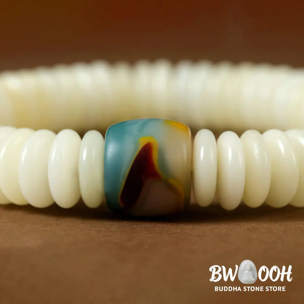 BWOOOH Natural White Bodhi Seed Wisdom Tassel Wrist Mala Bracelet, featuring dark-speckled Bodhi seeds (3x10mm) with a white copper accent and soft tassel, on a 14-15cm elastic string. Ideal for meditation and spiritual balance. - View 4