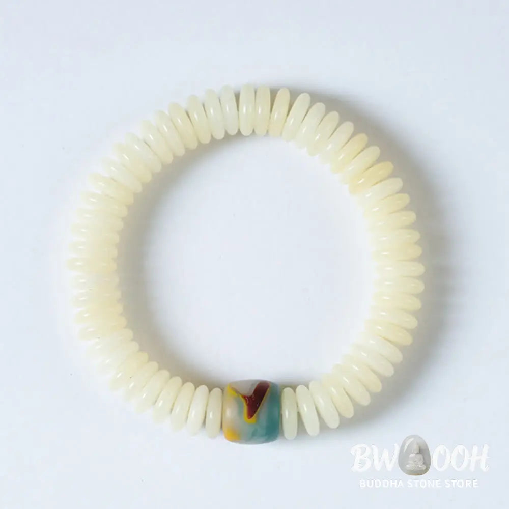 BWOOOH Natural White Bodhi Seed Wisdom Tassel Wrist Mala Bracelet, featuring dark-speckled Bodhi seeds (3x10mm) with a white copper accent and soft tassel, on a 14-15cm elastic string. Ideal for meditation and spiritual balance. - View 7