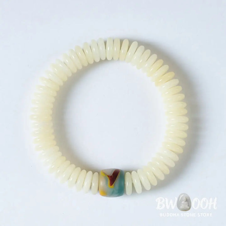 BWOOOH Natural White Bodhi Seed Wisdom Tassel Wrist Mala Bracelet, featuring dark-speckled Bodhi seeds (3x10mm) with a white copper accent and soft tassel, on a 14-15cm elastic string. Ideal for meditation and spiritual balance. - View 7