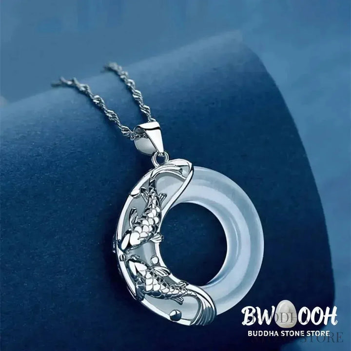 BWOOOH Natural White Jade Koi Lucky Necklace, featuring a polished 22x22mm white jade pendant intricately carved with two koi fish, suspended on a 40cm copper chain. Represents protection, happiness, and wealth. - View 3