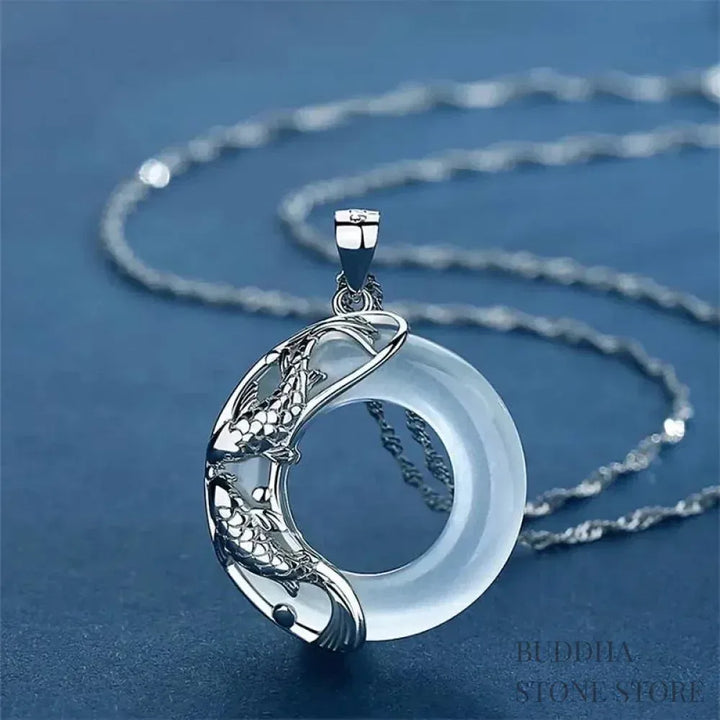 BWOOOH Natural White Jade Koi Lucky Necklace, featuring a polished 22x22mm white jade pendant intricately carved with two koi fish, suspended on a 40cm copper chain. Represents protection, happiness, and wealth.