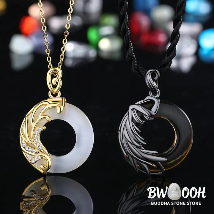 A BWOOOH Obsidian Chalcedony Meditation Round Pendant Necklace, 45cm length, featuring polished black obsidian and serene chalcedony, strung on a subtle copper chain, glowing under soft light. - View 5