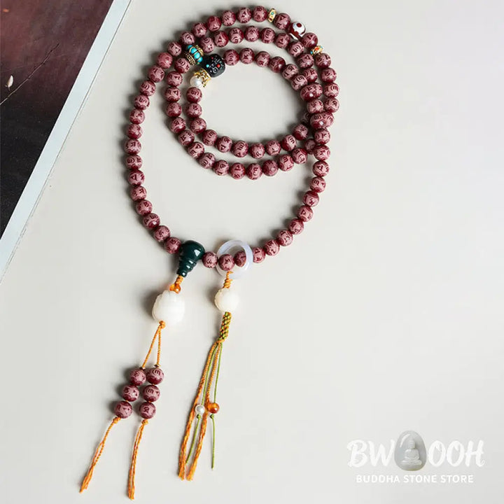 BWOOOH Red Bodhi Seed Harmony Bracelet, 10mm dark-speckled beads. Features engraved Om Mani Padme Hum mantra and Lotus symbol, accented with Liuli Glass, Pearl, Agate, Turquoise beads. Unisex design for spiritual balance and enlightenment. - View 12