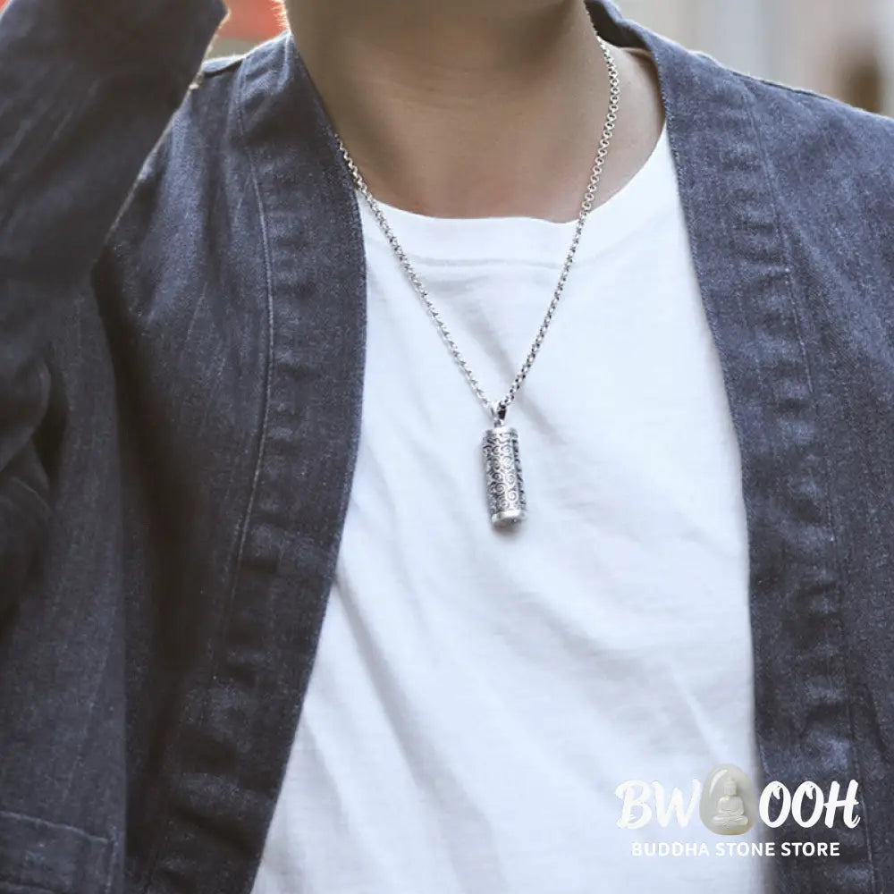 A close-up of the BWOOOH Six True Words Protection Necklace Pendant, crafted from silver plated copper, showcasing the 'Om Mani Padme Hum' mantra. The 4.1x1.4cm unisex pendant reflects spiritual wisdom and peace. - View 2