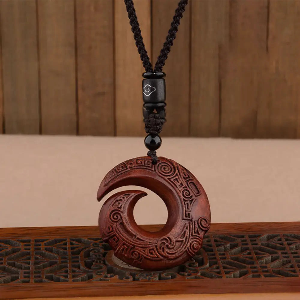 BWOOOH 'One's Luck Improves' Peace Buckle pendant, handcrafted from rich Small Leaf Red Sandalwood & deep Ebony Wood, symbolizing spiritual protection, longevity, and balance.